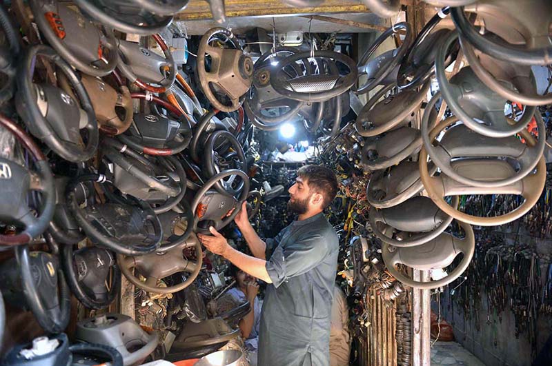 Vendor display a wide range of second-hand auto spare parts at Shoba Bazaar, bustling market, known for its affordable vehicle parts, draws customers looking for budget-friendly alternatives to new spare parts