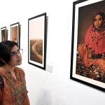 A visitor shows her keen interest in the photographs displayed at the exhibition 'The Too-Young Monsoon Brides' by French photographer Isabeau de Rouffignac at the Zahoor-ul-Akhlaq Art Gallery. The exhibition was organized by Alliance Française Lahore in collaboration with the French Embassy in Pakistan and the National College of Arts