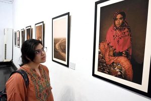 A visitor shows her keen interest in the photographs displayed at the exhibition 'The Too-Young Monsoon Brides' by French photographer Isabeau de Rouffignac at the Zahoor-ul-Akhlaq Art Gallery. The exhibition was organized by Alliance Française Lahore in collaboration with the French Embassy in Pakistan and the National College of Arts