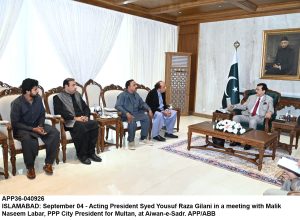 Acting President Syed Yousuf Raza Gilani talking to Ali Syed, Chairman National Insurance Company Limited, at Aiwan-e-Sadr.
