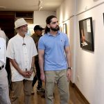 Chief guest and Arts Council President Muhammad Ahmed Shah views artworks at the inauguration of “Unspoken Spaces,” an exhibition featuring works by artist Karam Aspal, at Art City Gallery