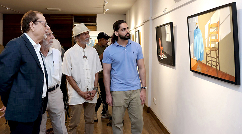 Chief guest and Arts Council President Muhammad Ahmed Shah views artworks at the inauguration of “Unspoken Spaces,” an exhibition featuring works by artist Karam Aspal, at Art City Gallery