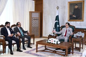 Acting President Syed Yousuf Raza Gilani talking to Ali Syed, Chairman National Insurance Company Limited, at Aiwan-e-Sadr.