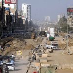 Development work on the Red Line BRT project is underway with heavy machinery along University Road in the provincial capital
