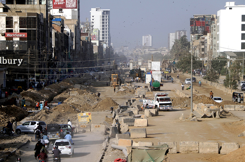Development work on the Red Line BRT project is underway with heavy machinery along University Road in the provincial capital
