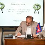 Dr Musadik Malik records his heartfelt condolences for the victims of the devastating floods in Nepal in the book of remembrance