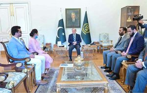 Prime Minister Muhammad Shehbaz Sharif hands over a cheque of reward of 1 Crore to Ms. Razia Naureen, a nurse of PIMS Islamabad, who saved life of a child during an unfortunate incident at NICU of the PIMS.