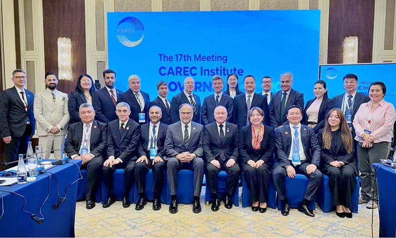Federal Minister for Planning, Development and Special Initiatives Ahsan Iqbal in a group photograph with participants of the Governing Council Meeting of the CAREC Institute