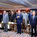 Prime Minister Muhammad Shehbaz Sharif and other dignitaries standing in respect while national anthems of China and Pakistan are played at a ceremony to celebrate the 77th anniversary of the founding of the People's Republic of China