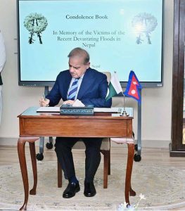 Prime Minister Muhammad Shehbaz Sharif writes his remarks in condolence book for victims of the recent devastating floods in Nepal.
