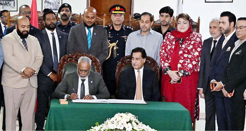 Speaker of the People's Majlis of Maldives Mr. Abdul Raheem Abdulla inscribing his remarks in Visitor Book in Parliament House
