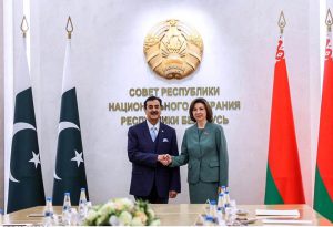 Chairman Senate of Pakistan Syed Yousaf Raza Gilani shaking hands with Natalya Kochanova, Chairman of the Council of the Republic of Belarus, in Belarus.