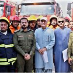 Political Secretary to PPP Chairman and MPA Jameel Ahmed Soomro poses for a group photo with Larkana Mayor Adv. Anwar Ali Luhar and fire brigade staff after handing over three fire brigade vehicles provided by the Sindh Government during a ceremony at the Municipal Stadium