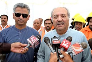 Political Secretary to PPP Chairman and MPA Jameel Ahmed Soomro poses for a group photo with Larkana Mayor Adv. Anwar Ali Luhar and fire brigade staff after handing over three fire brigade vehicles provided by the Sindh Government during a ceremony at the Municipal Stadium