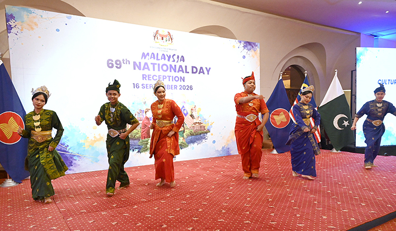 Malysian artists and performing their tadation dance during celebrations marking Malaysia's 69th National Day at a local hotel