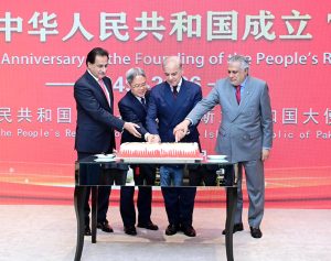 Prime Minister Muhammad Shehbaz Sharif along with Speaker National Assembly Sardar Ayaz Sadiq, Deputy Prime Minister and Foreign Minister Mohammad İshaq Dar and Chinese Ambassador to Pakistan, Jiang Zaidong cutting a cake to celebrate the 77th anniversary of the founding of the People's Republic of China