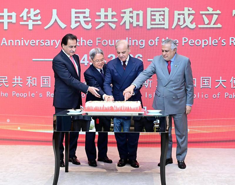 Prime Minister Muhammad Shehbaz Sharif along with Speaker National Assembly Sardar Ayaz Sadiq, Deputy Prime Minister and Foreign Minister Mohammad İshaq Dar and Chinese Ambassador to Pakistan, Jiang Zaidong cutting a cake to celebrate the 77th anniversary of the founding of the People's Republic of China