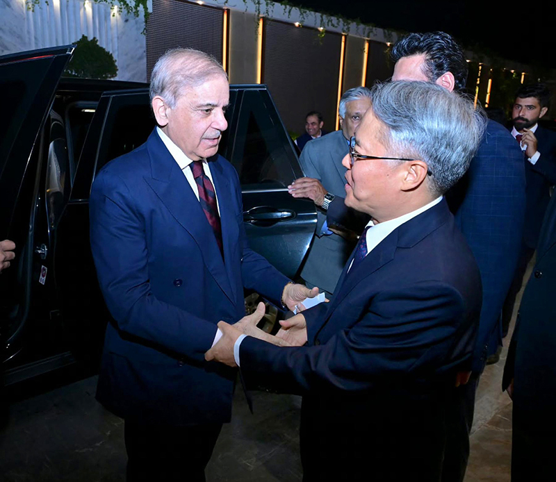 Chinese Ambassador to Pakistan, Jiang Zaidong welcoming Prime Minister Muhammad Shehbaz Sharif upon arrival at the ceremony to celebrate the 77th anniversary of the founding of the People's Republic of China