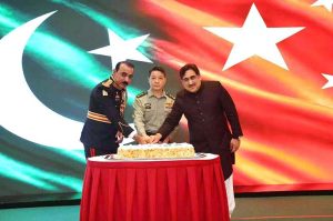 Chargé d'Affaires, Aizaz Khan, a.i. of the Embassy of Pakistan, Brigadier Ali Asghar Khan, Defence and Army Attaché of the Embassy of Pakistan and Lt. Gen. Luo Huiqi, Secretary of the Commission for Discipline Inspection Director of the Supervisory Commission of the PLA Army are cutting the cake at Defence and Martyrs Day reception organised by the Embassy of Pakistan