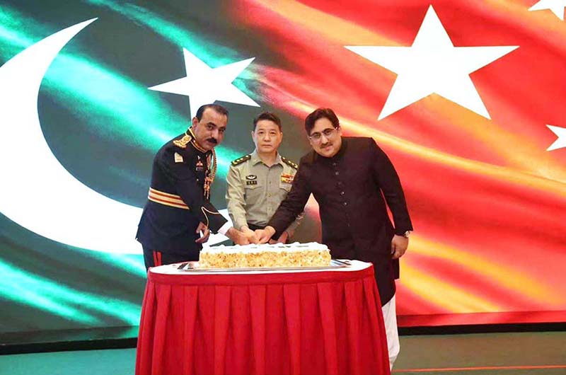 Chargé d'Affaires, Aizaz Khan, a.i. of the Embassy of Pakistan, Brigadier Ali Asghar Khan, Defence and Army Attaché of the Embassy of Pakistan and Lt. Gen. Luo Huiqi, Secretary of the Commission for Discipline Inspection Director of the Supervisory Commission of the PLA Army are cutting the cake at Defence and Martyrs Day reception organised by the Embassy of Pakistan
