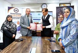 Vice Chancellor the Isamia University of Bahawalpur Prof. Dr. Muhammad Kamran exchanging MOU documents with Tariq Mehmood Director Punjab Nursing and Health Workforce Reform program Government of Punjab.
