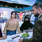 Women visitors gather information while exploring a stall at the 28th ITCN Asia 2026 at the Expo Centre