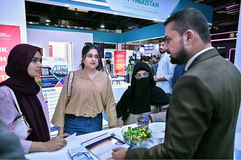 Women visitors gather information while exploring a stall at the 28th ITCN Asia 2026 at the Expo Centre