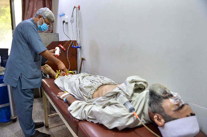 A healthcare professional conducts an electrocardiogram (ECG) test on a patient at the Lady Reading Hospital during World Heart Day