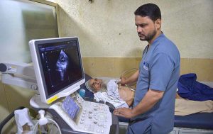 A healthcare professional conducts an electrocardiogram (ECG) test on a patient at the Lady Reading Hospital during World Heart Day