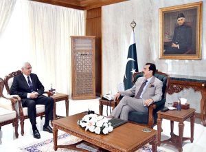 Acting President Syed Yousuf Raza Gilani in a meeting with Justice (R) Irfan Qadir, Consultant Legal Affairs, at Aiwan-e-Sadr.