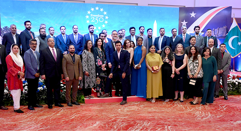 US Consul General Stetson Sanders is posing for a group photo with US consulate staff at the 'Freedom 250' reception held at a local hotel