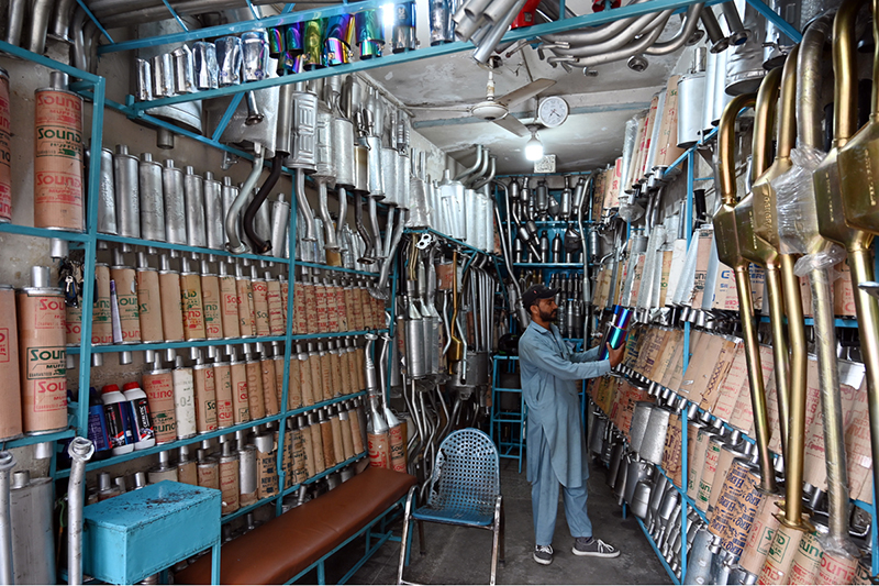 A vendor displays a wide range of car mufflers and silencers at his shop on Stadium Road