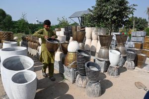 Women nature enthusiasts select seasonal outdoor plants for their home garden at a roadside nursery along the Expressway.
