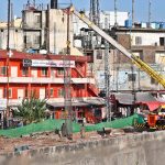 Heavy machinery, including excavators and cranes, is deployed at the service road construction site along the Expressway as development work continues to improve the road infrastructure in the Federal Capital