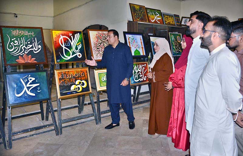 Visitors take a keen interest in artworks displayed at the 21st Annual Quranic Calligraphy Exhibition at the Arts Council