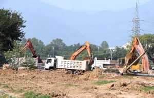 Heavy machinery being used during construction work of Kashmir Chowk underpass during development work in Federal Capital.