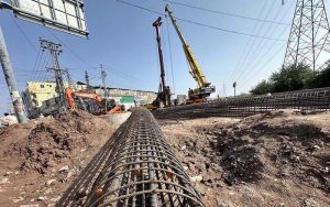 Heavy machinery is deployed for construction work on the Faizabad–Gulberg Greens Service Road project in federal capital.