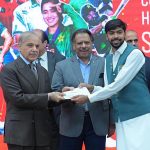 Prime Minister Muhammad Shehbaz Sharif distributes reward cheques amongst the medal winners of the Asian Games