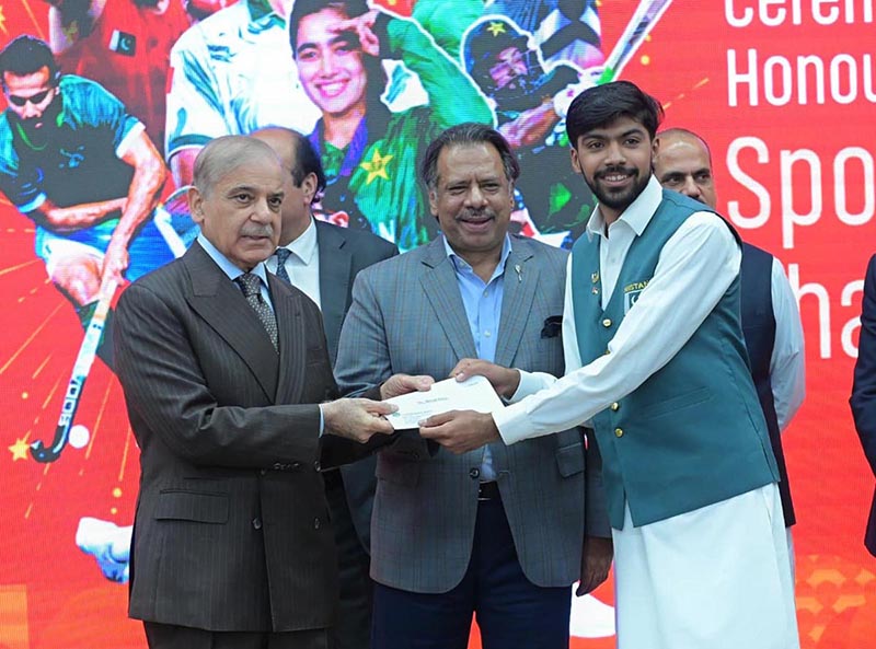 Prime Minister Muhammad Shehbaz Sharif distributes reward cheques amongst the medal winners of the Asian Games