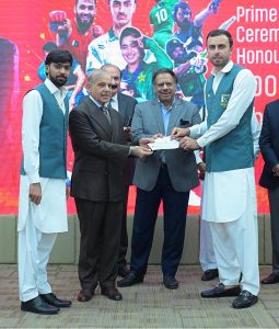 Prime Minister Muhammad Shehbaz Sharif distributes reward cheques amongst the medal winners of the Asian Games