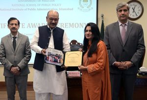 Secretary, Establishment Division, Barrister Nabeel A. Awan presents certificates to participants during the passing-out ceremony of the 47th Mid-Career Management Course at NIPA