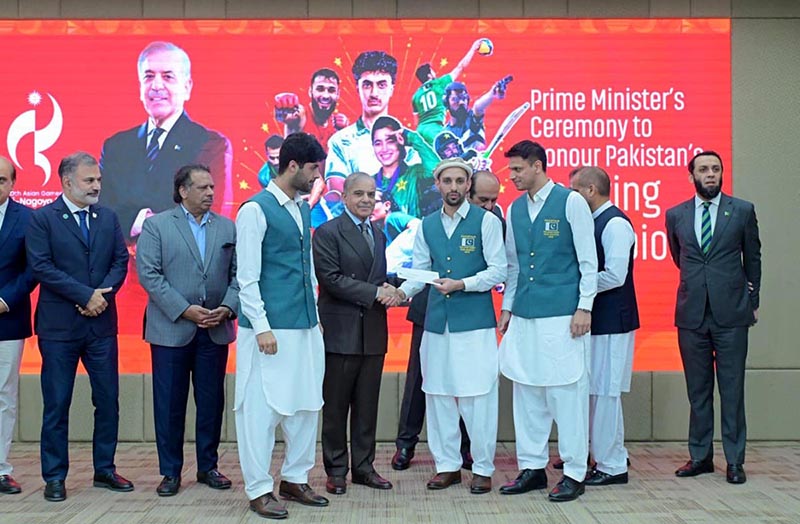 Prime Minister Muhammad Shehbaz Sharif distributes reward cheques amongst the medal winners of the Asian Games