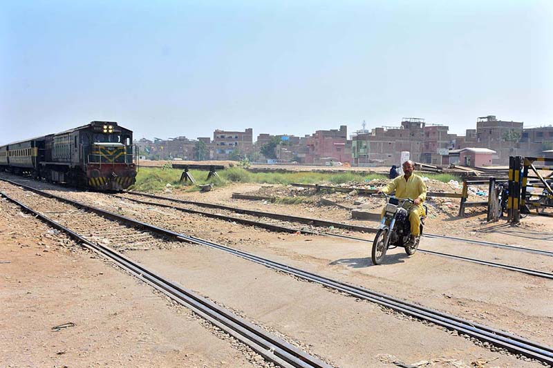 A motorcyclist crossing the railway tracks near the railway station while a train is approaching may cause a mishap and needs the attention of the concerned authorities