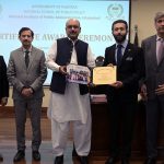 Secretary, Establishment Division, Barrister Nabeel A. Awan presents certificates to participants during the passing-out ceremony of the 47th Mid-Career Management Course at NIPA
