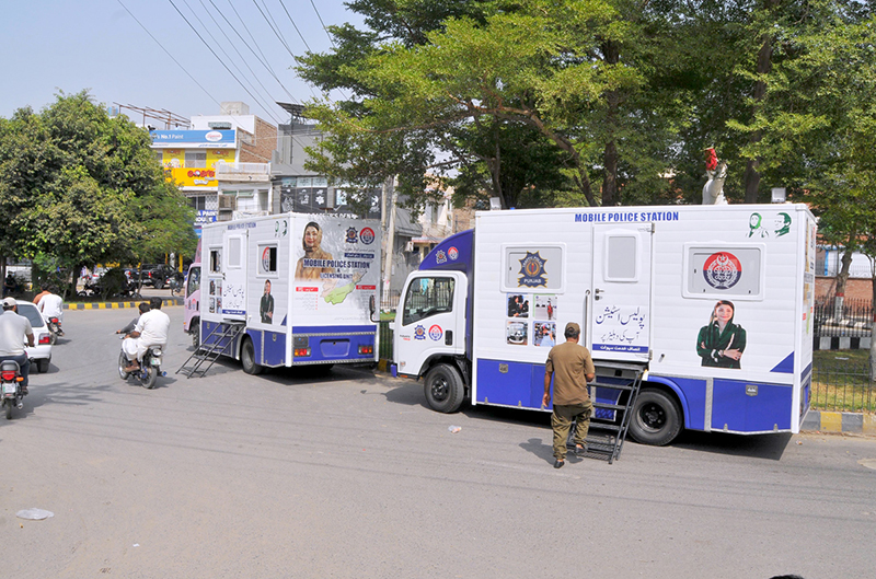 Punjab Police Mobile Station vans parked roadside, offering accessible public services and police assistance to residents