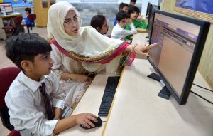 A school teacher instructs students during a classroom session at The City School, Warsak Campus, in connection with World Teachers’ Day.