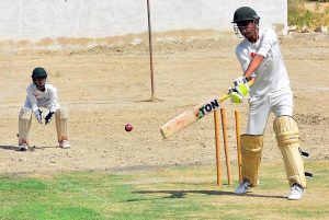A young fast bowler gets ready to deliver the ball during the Pakistan Cricket Board (PCB) Under-17 trials for the Hyderabad Region team at the PCB Cricket Ground.