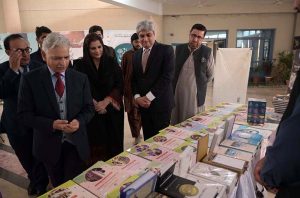 Parliamentary Secretary for Federal Education and Professional Training Rabia Naseem Farooqi and Federal Secretary Nadeem Mahbub view calligraphy artworks during the inauguration of a book fair and calligraphy exhibition at the Institute of Art and Design auditorium in F-11/1.