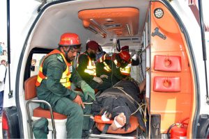 Rescue workers evacuate an injured passenger from a coach after 14 coaches of the Karachi–Peshawar-bound Rehman Baba Express derailed near Sher Shah Railway Station at least four passengers were killed and 49 injured in the incident.