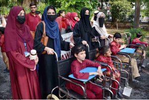 Participants march during an awareness walk organized by the Eilya Care Foundation to mark World White Cane Safety Day at D-Ground Chowk.